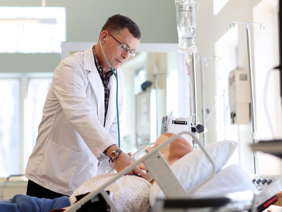 Michael Horvath practicing on a simulation dummy